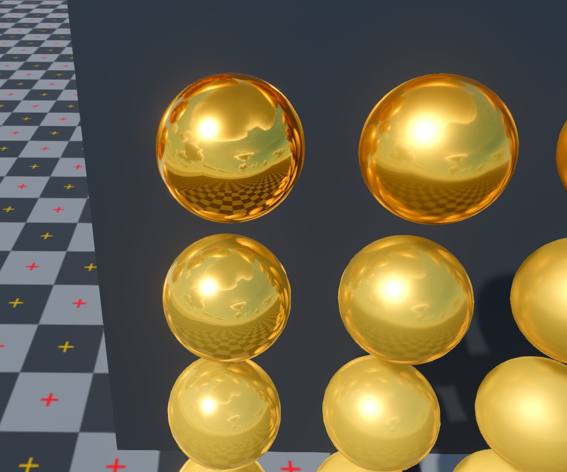 Close-up of polished gold spheres reflecting the sun, sky and checkered floor